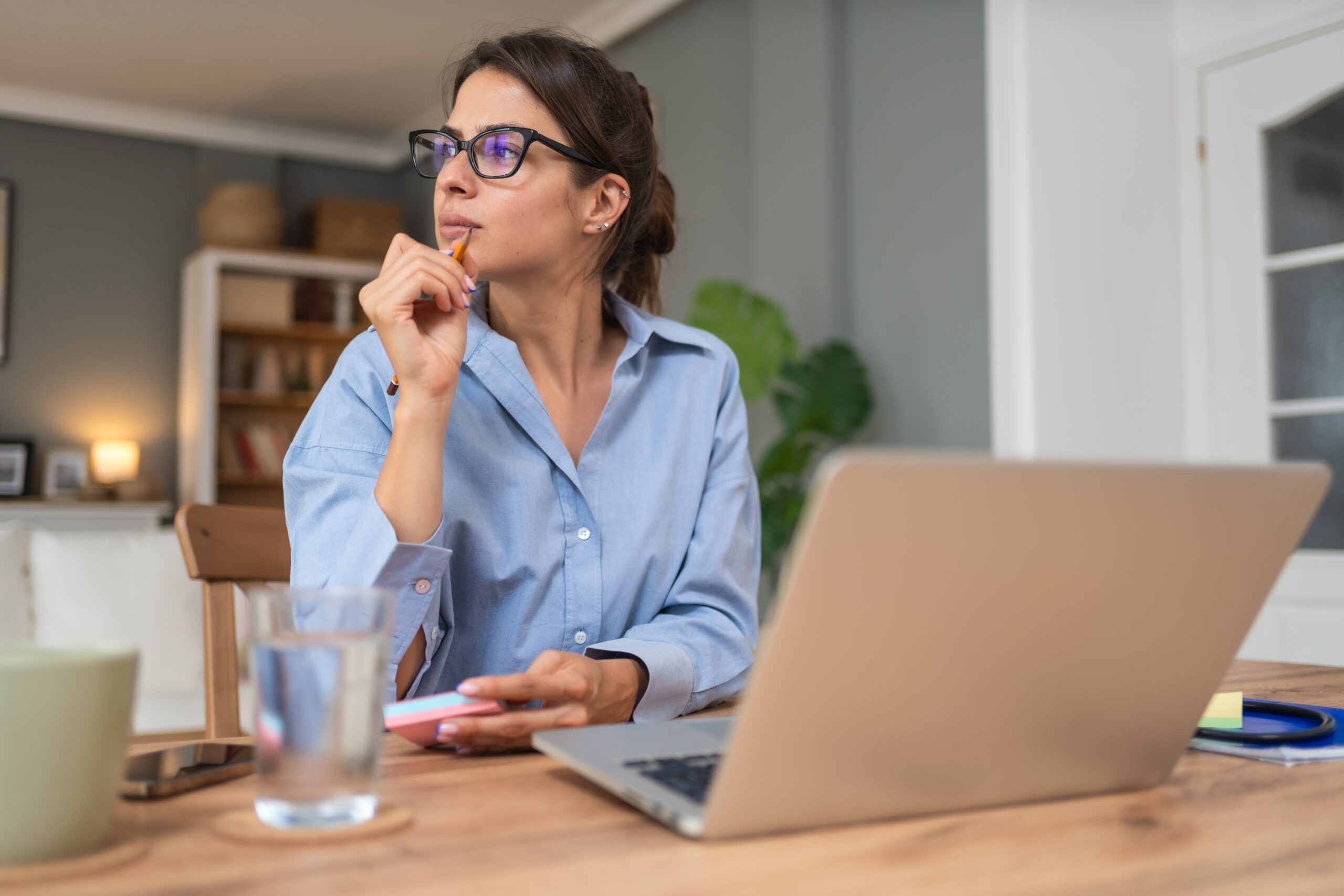 A female new grad thinking about interview questions.