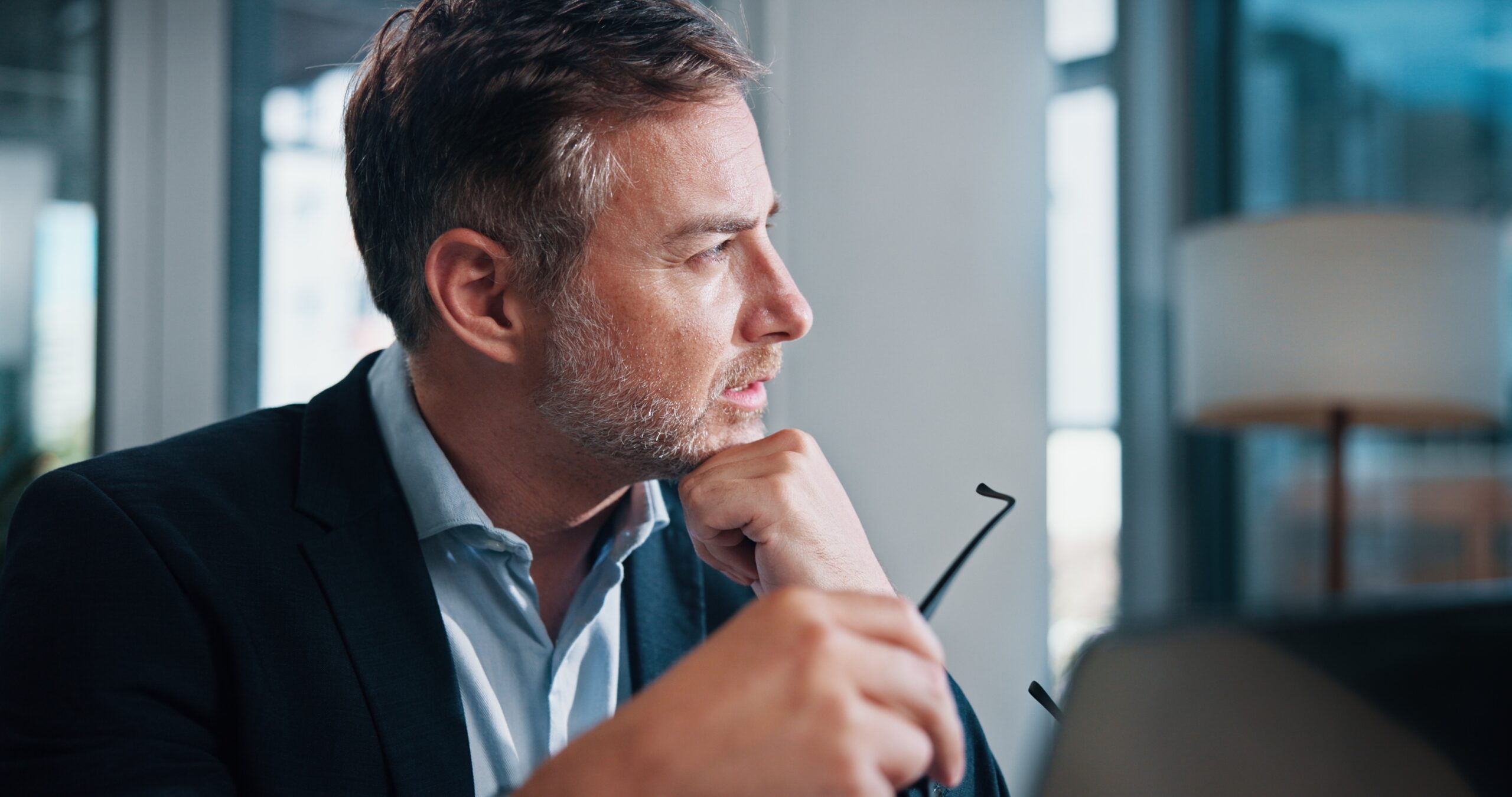 Businessman thinking if he needs to hire a marketing agency.